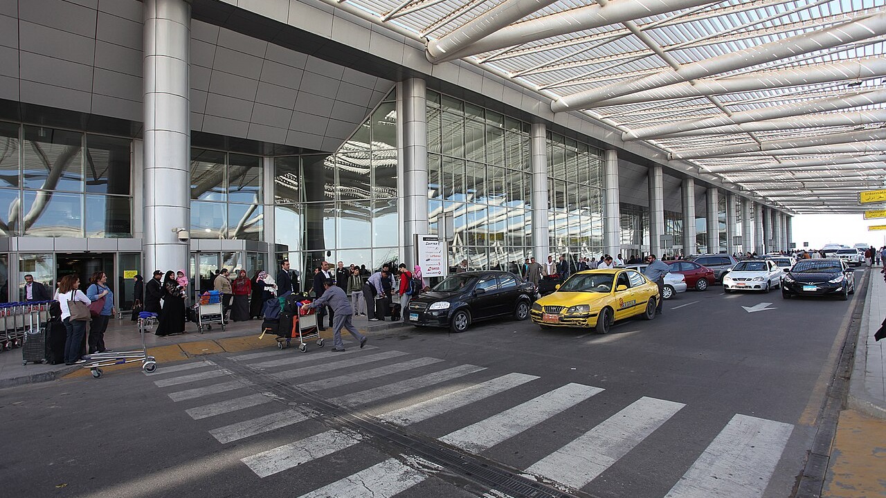 Travellers and taxis outside the departures entrance of Terminal 3 at Cairo International Airport.