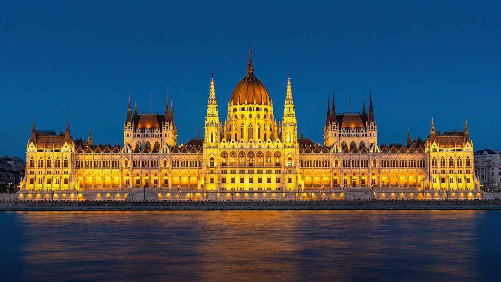 The Hungarian Parliament Building lit up at dusk across the Danube in Budapest, one of the city breaks tested under GBP 150
