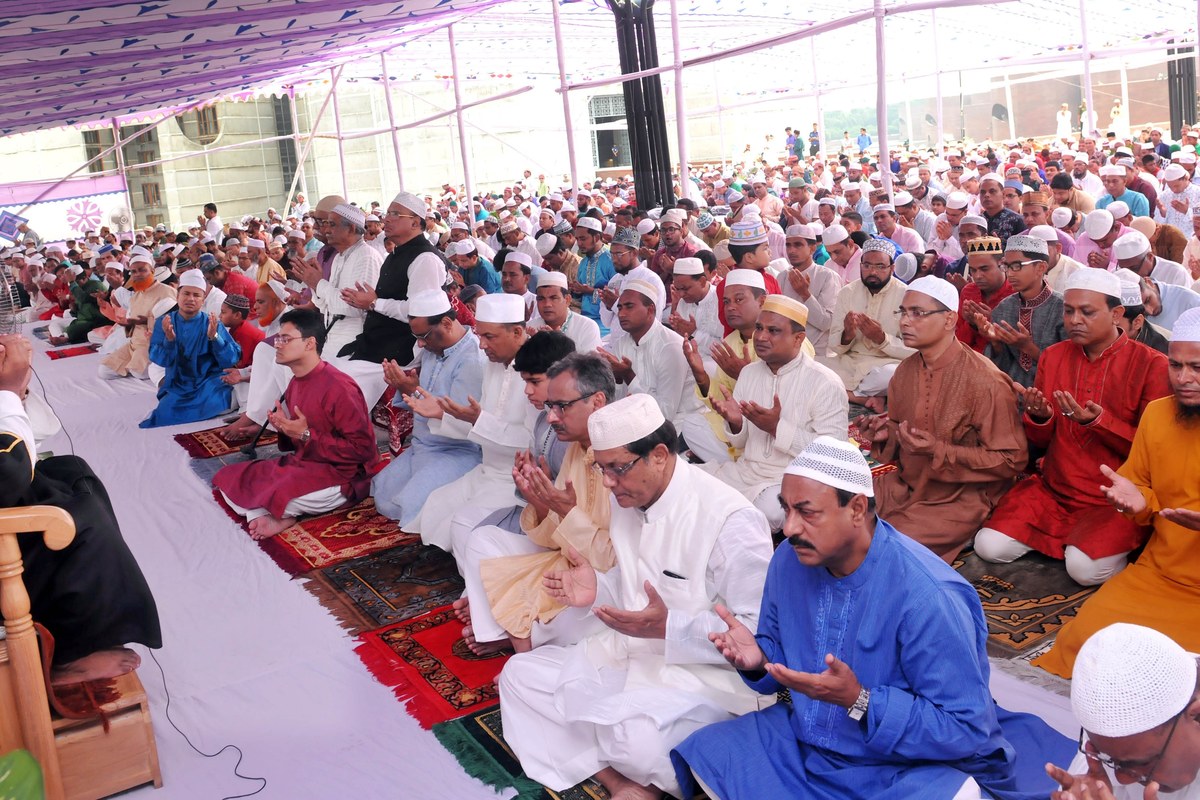 Worshippers gather for Eid al-Fitr prayers under a decorated canopy at the National Parliament South Plaza in Bangladesh